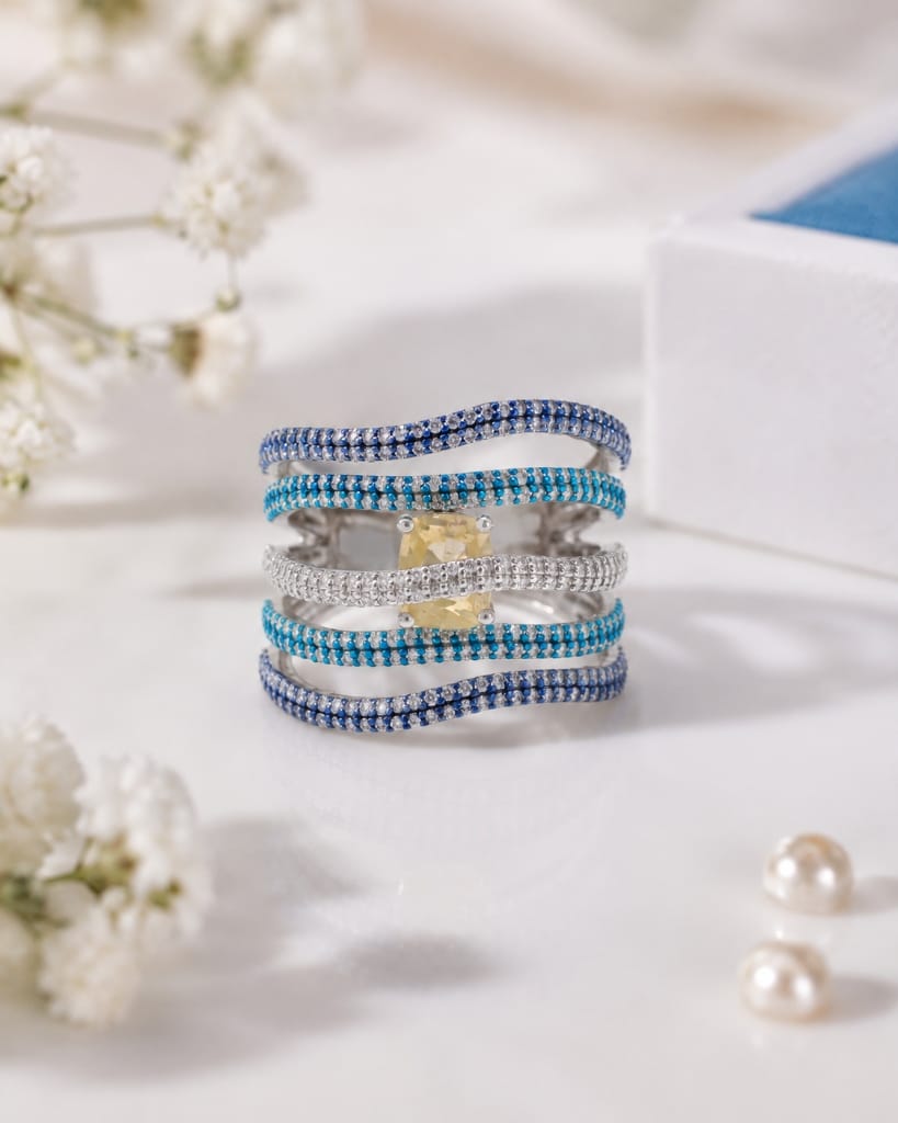 Colourpop multi-tier blue sapphire wave ring with cushion yellow stone