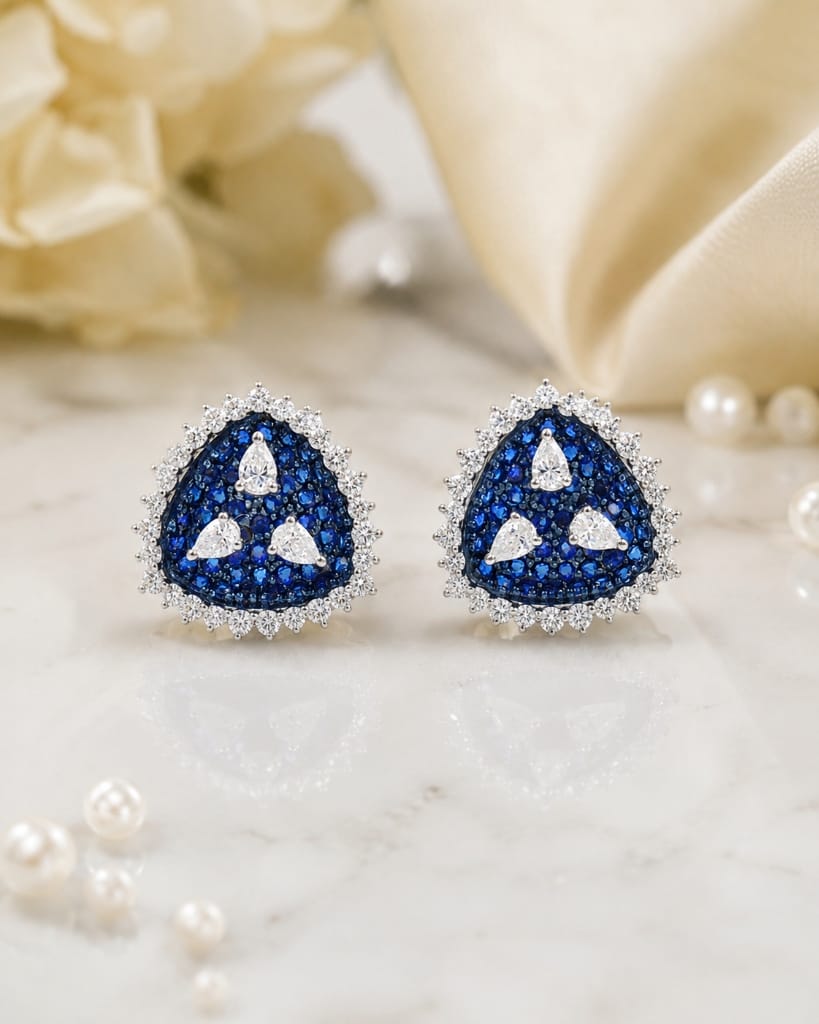 Floating blue sapphire triangular cluster stud earrings with pear diamonds