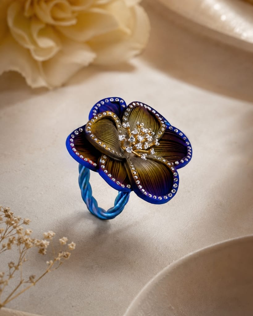 Titanium Womens anodized blue and bronze sculpted titanium flower ring with diamond cluster center