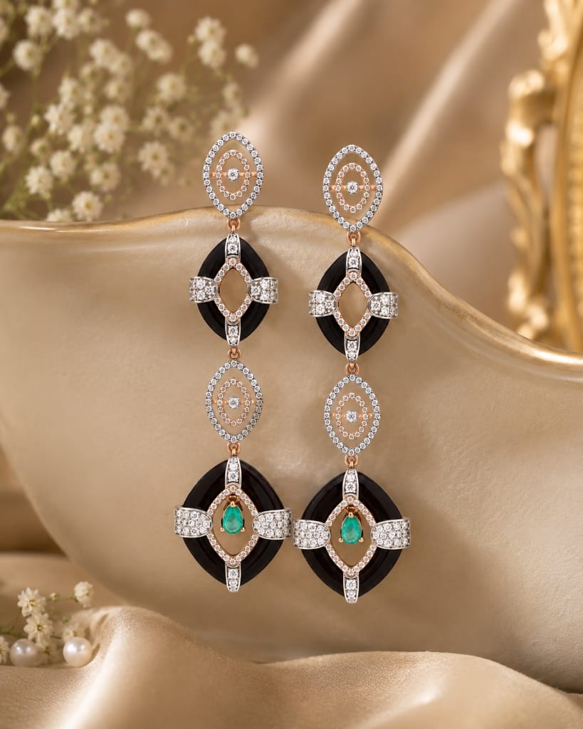 Wood collection long drop earrings with dark wood oval rings, rose gold diamond frames, and emerald drops
